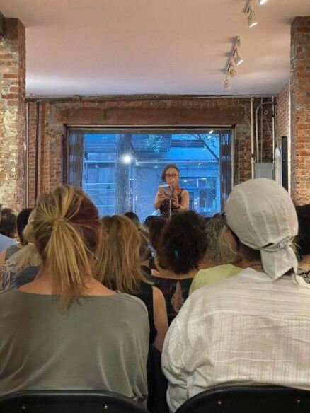Author Sue Mell reading to a packed hall for her booklaunch.