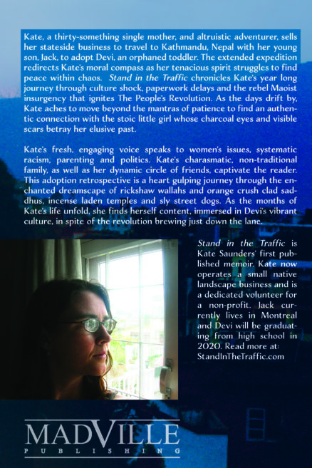 Back cover of STAND IN THE TRAFFIC: A HIMALAYAN ADOPTION STORY shows a dark blue background of enormous mountains with an inset of the author gazing out. She's a 30-something woman with straight brown hair and glasses. She looks serious.