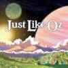 Just Like Oz: Essays on a Few Poet Wizards & Their Multifaceted Magic, by George Drew. The text mimics the original Wizard of Oz books, and it is overlaid on a cartoonish landscape with planets swirling on the horizon and emerald colored grasses.