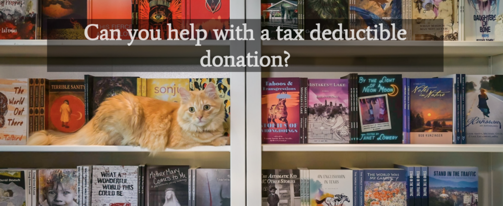 A fluffy orange cat on a bookshelf filled with books produced by Madville Publishing asks "Can you help with a tax deductible donation?"
