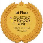 1st Place Connecticut Press Club 2022 Award Winner. Gold Seal with black letters surrounded by laurel leaves with a star at the top.