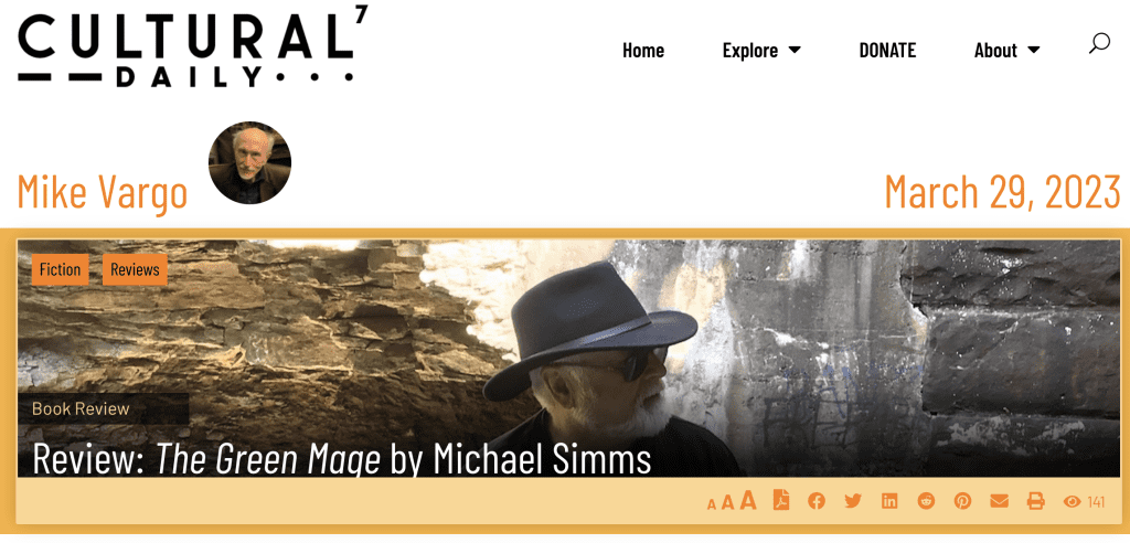 Header for a review of Michael Simms new YA novel, The Green Mage. Review is by Mike Vargo for the Cultural Daily. A picture of Michael Simms, a white man with white hair, a white beard and sunglasses wears a cowboy hat and a black t-shirt. He appears in front of a waterfall.