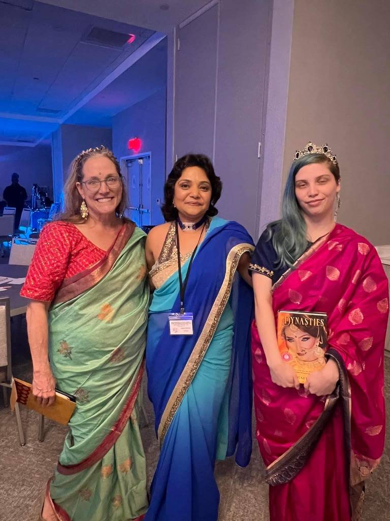 Madville founder Kim Davis and her daughter Liz Davis pose with author Anju Gattani and her new book, Dynasties, at the Author Meet and Greet/Launch Party for Dynasties.