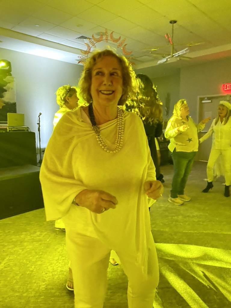 Author Eileen Sanches (Freedom Lessons: A Novel) dances during the "Hair Ball."