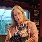 Madville Publishing founder Kim Davis reads at the Offsite Reading at The Chieftain Irish Pub: Madville Publishing, Iris Press, and Stephen F. Austin State University Press. Photo by Lee Zacharias.