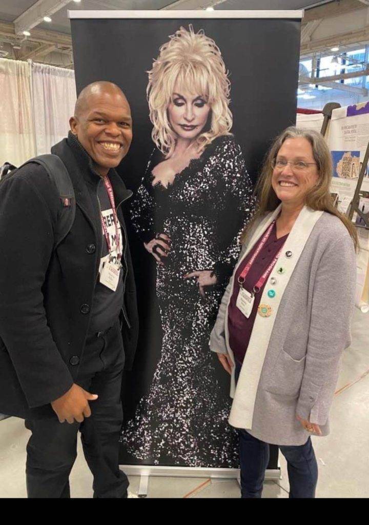 Author Maurice Carlos Ruffin and Madville Publishing founder Kim Davis take a photo with Dolly at the Book Fair. Photo by Lee Zacharias.