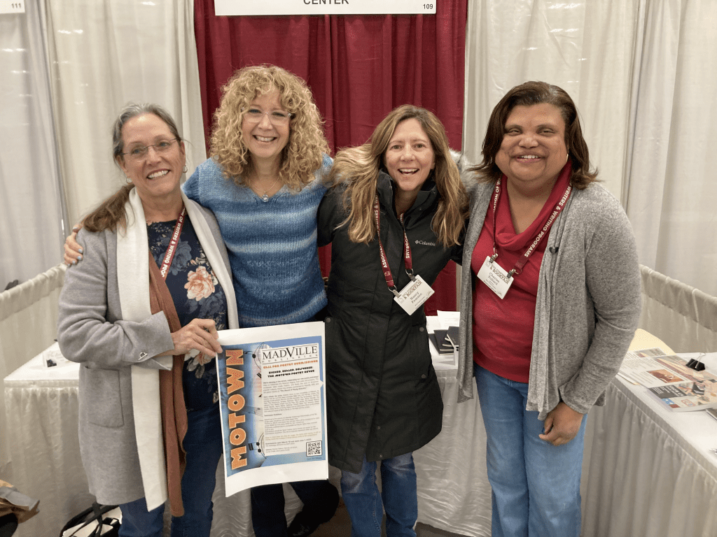 Madville Publishing founder Kim Davis, author Lisa Lanser Rose, unknown, and writer Cherise Pollard take a group photo.