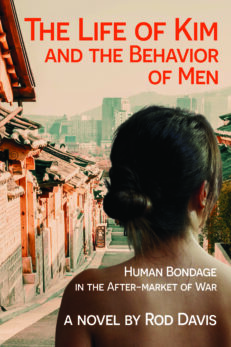 Cover image for THE LIFE OF KIM AND THE BEHAVIOR OF MEN: Human Bondage in the After-market of war, a novel by Rod Davis. The red and white letters are superimposed over picture of a sloping street flanked by tile-roofed buildings on the outskirts of Seoul. South Korea. A young woman, apparently naked, faces away from the camera, looking down the street. We can only see her head and shoulders.