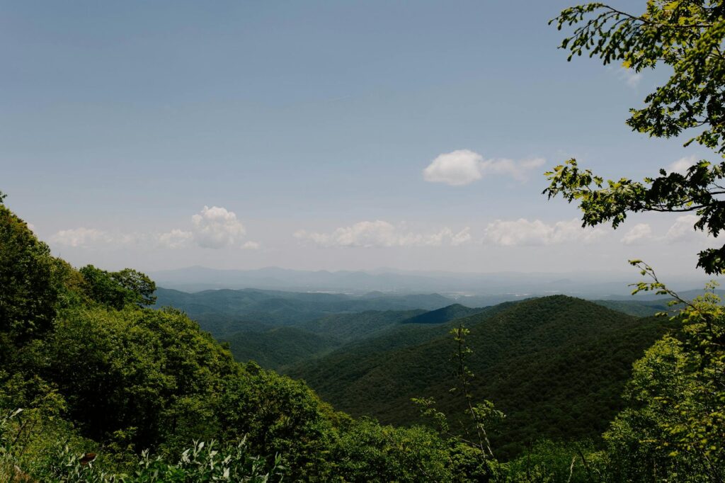 a box with a link in the middle of it to all the books that have previously won the arthur smith poetry prize. There's a background image of the appalachian mountains with gray overlay on top and white text.