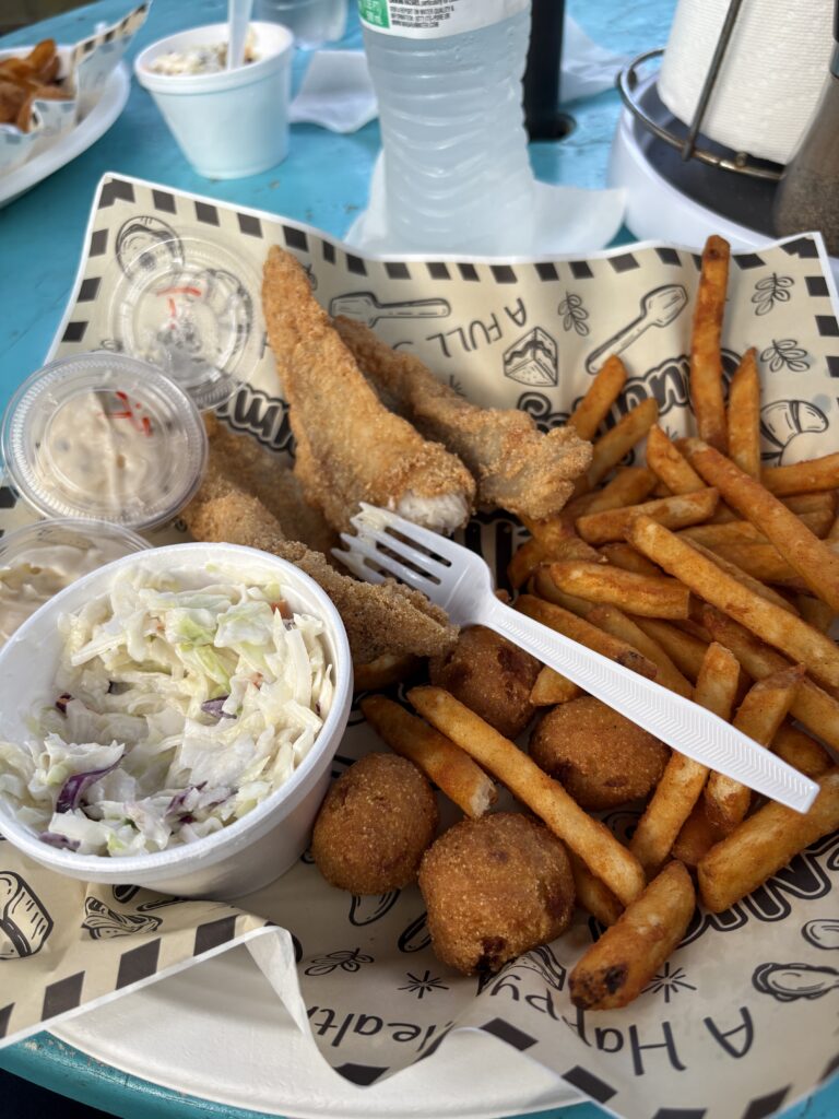 plate of fried catfish, French fries, and coleslaw